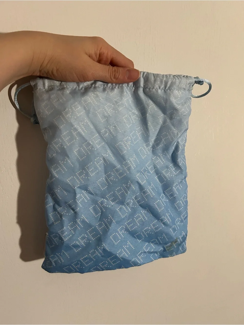 Light Blue Drawstring Pouch with 'DREAM' Pattern